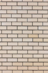 Yellow bricks in the wall as an abstract background