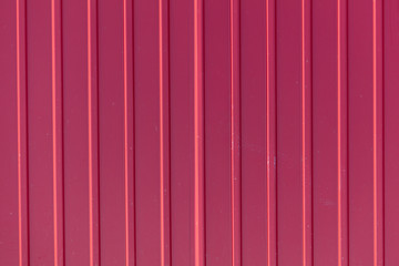 Red metal sheet metal profile as background