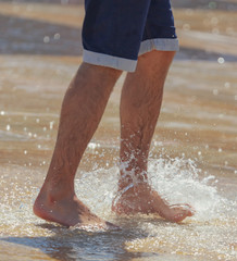 Feet in the water in a fountain