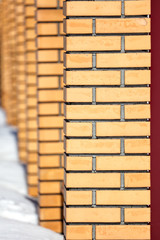 Yellow bricks in the wall as an abstract background