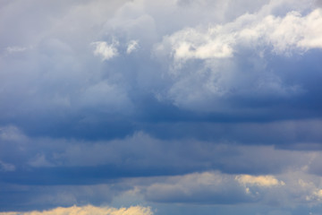 Naklejka na ściany i meble Clouds before the rain as a background