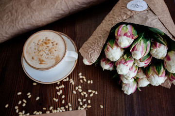 Cappuccino with nuts on the table.