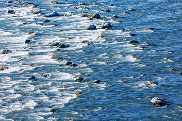 River calmly flowing among the stones.