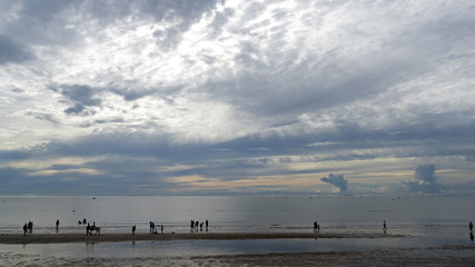 Morning on the Hua Hin beach is a bit gloomy when storm clouds still linger after heavy rain during the night.