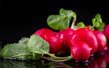 Red fresh radish on wooden