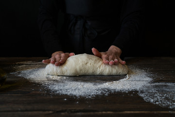 Hands working with dough preparation recipe bread, pizza or pie making ingridients, food flat lay...