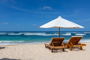 Place for beach holidays with umbrellas at  Bali island,Nusa Dua beach area,Indonesia