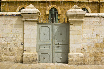 A double doored steel gate into a property in the Arab Quarter of the Old Walled City of Jerusalem Israel