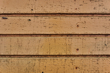 Painted yellow wood shabby horizontal background. Wooden barn wall rustic texture.