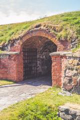 Fototapeta na wymiar old gates, ironwork, stone brick wall