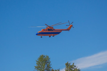 Obraz na płótnie Canvas the fire, rescue helicopter over the city