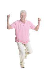 Portrait of a happy senior man posing isolated