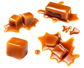 Flowing caramel sauce isolated on white background. Golden Butterscotch toffee caramel liquid .