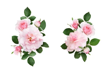 Fotobehang Rozen Set roze roze bloemen en groene bladeren in een bloemstuk