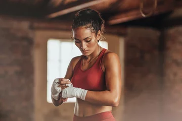 Poster Female boxer wearing strap on wrist © Jacob Lund