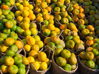 Orange in a small basket on sale in Madagascar