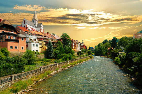 Beautiful city of Murau, Tyrol, Austria, Europe, with river, houses and church