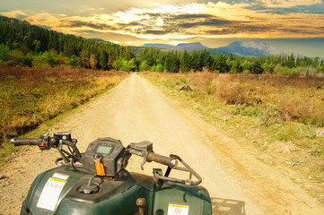Quadbike on the road toward a forest and mountain in Hogsback South Africa © Hajakely