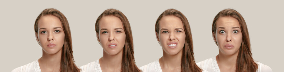 Annoyed irritated young feeling frustrated with something against gray studio. Human facial...