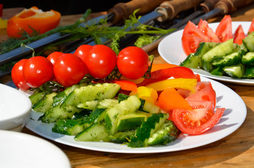 fresh vegetables cucumber tomatoes pepper and salad leaves
