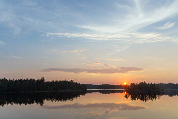 sunset over a forest lake
