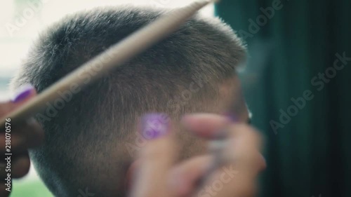 Close Up View On Professional Haircut Process In Barber Shop