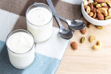 Yogurt in two glasses with dried fruit is a healthy breakfast.