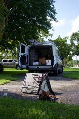 air conditioner evaporator cleaning-outside with service truck in background