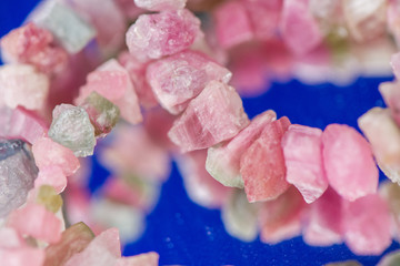 Macro shot of watermelon tourmaline crystals in necklace. Natural, rough, unpolished stones....