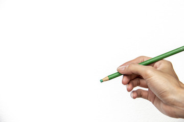 hand holding green pencil isolate on white background