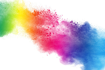 Multicolored powder explosion on white background.