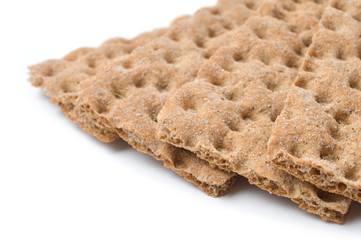 Slices of crunchy crispbread isolated on white background.