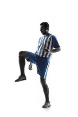 Professional football soccer player in action or movement isolated on white studio background