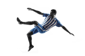 Professional football soccer player in action or movement isolated on white studio background