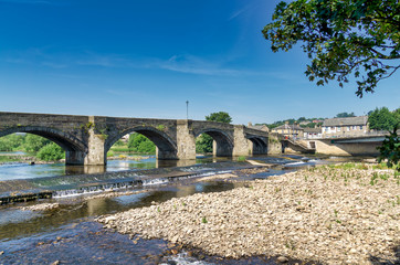 a view of Old Haydon bridge, a picturesque structure in Northumberland, England.