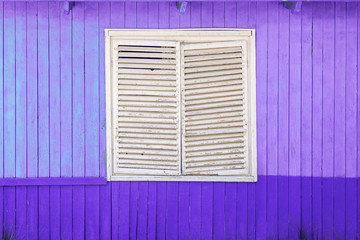 white window and lavender colors wooden wall