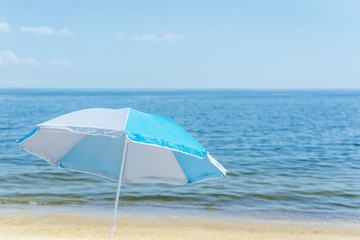 umbrella on sand beach and sea background. soft focus