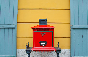 Mailbox next to the wall of the house