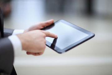 Close-up Of Businessperson Using Digital Tablet With Blank Display