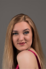 Naklejka premium Blond model in red dress