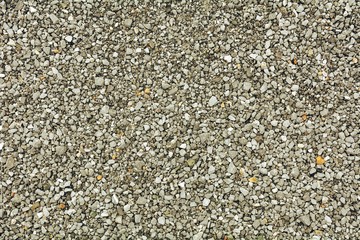 Light gray gravel (Pebble) floor texture background - top view.
