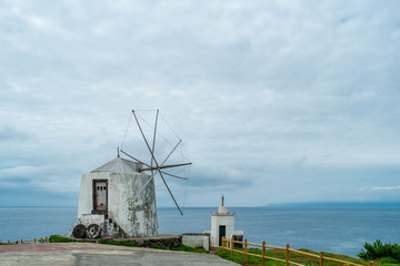 A windmill in Corvo Island Azores, on a cloudy day