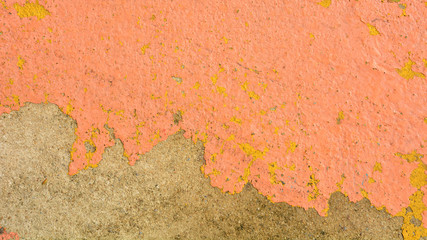 pink old paint texture is chipping and cracked at the wall