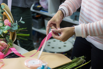 Professional florist at work - assembling a bouquet