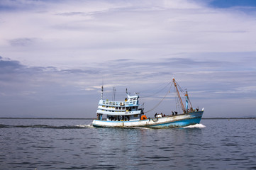 Fishing boat in a clam beautiful sea in gulf of Thailand. 