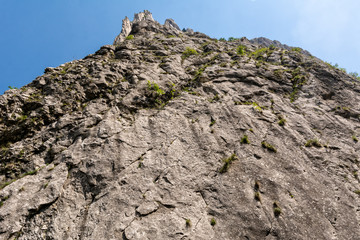 High mountain peak against blue sky