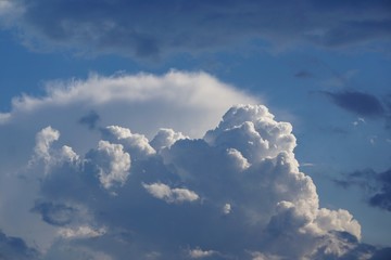Amazing cumulus clouds and sunlight on the background of clear blue sky, Summer in GA USA.