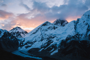 Evening view of mountains with beautiful sky on the way to Everest base camp, Khumbu valley, Sagarmatha national park, Everest area, Nepal. Sunrise over mountains ridge. Snowy mountains. Sunset time.