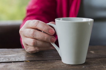 cup coffe in women hand