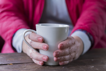 Elderly woman with cup of tea